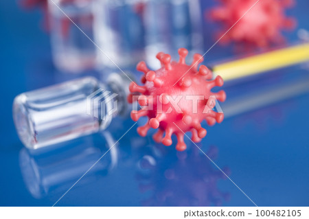 Close up medical syringe with a vaccine 100482105