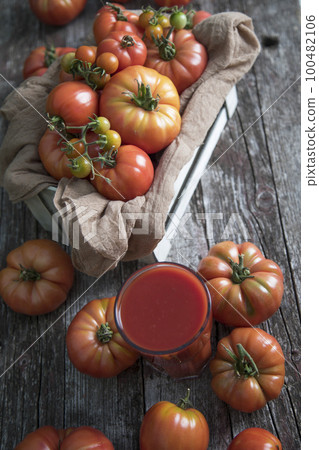 Fresh tomato juice, on a wooden background Fresh tomato juice, on a wooden background 100482106