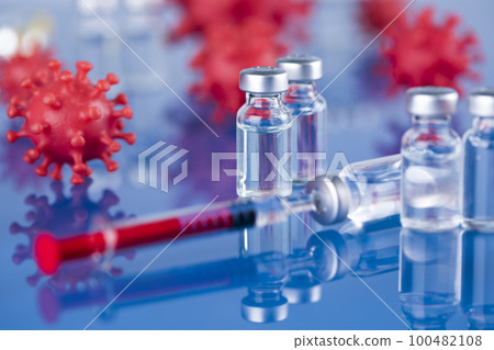 Close up medical syringe with a vaccine Close up medical syringe with a vaccine 100482108