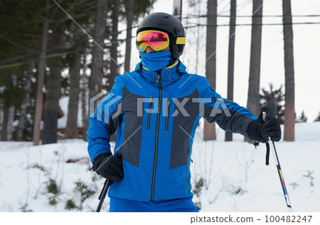Close-up of a skier in a sports helmet and ski goggles 100482247