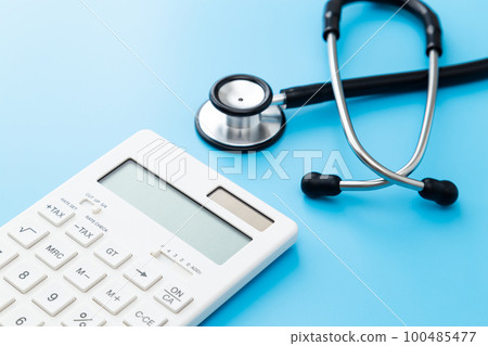 Stethoscope and calculator blue back Stethoscope and calculator blue back 100485477