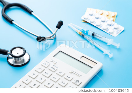 Stethoscope and calculator Blue background 100485645