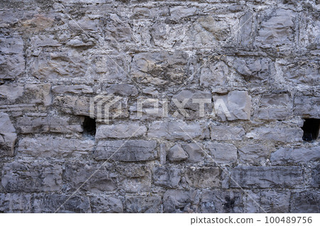 Stone wall structure of an old house 100489756
