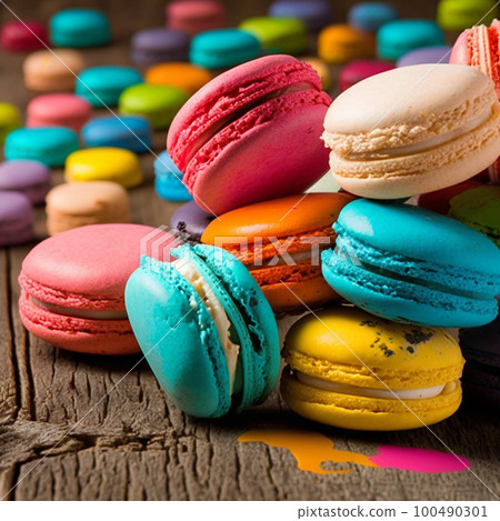 Cake macaron or macaroon stack on wooden table, colorful bright cookies closeup. 100490301