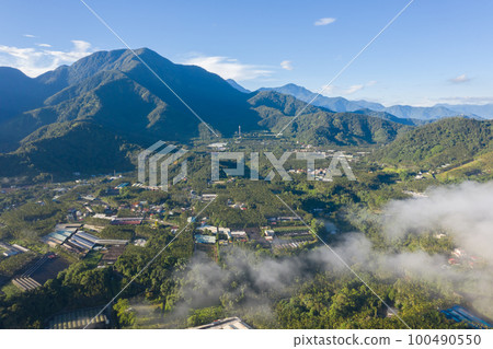 morning cloudy landscape with mist 100490550