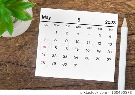 The May 2023 Monthly calendar for 2023 year with pen on wooden background. The May 2023 Monthly calendar for 2023 year with pen on wooden background. 100490578