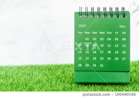 The Green May 2023 Monthly desk calendar for 2023 year on grass. The Green May 2023 Monthly desk calendar for 2023 year on grass. 100490588