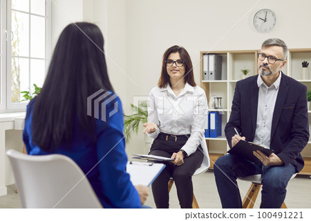 HR business managers are talking to a candidate at a job interview in the office HR business managers are talking to a candidate at a job interview in the office 100491221