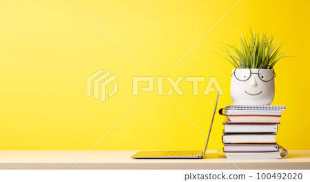 Laptop and stack of notepads Laptop and stack of notepads 100492020