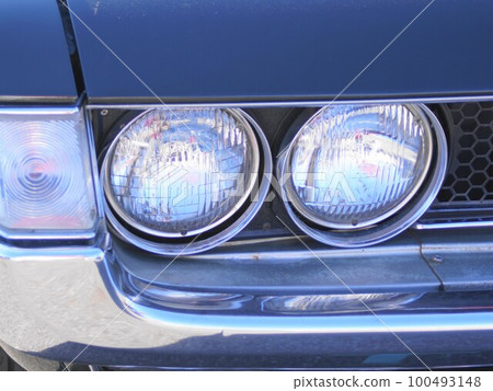 Rare classic car headlight closeup 100493148