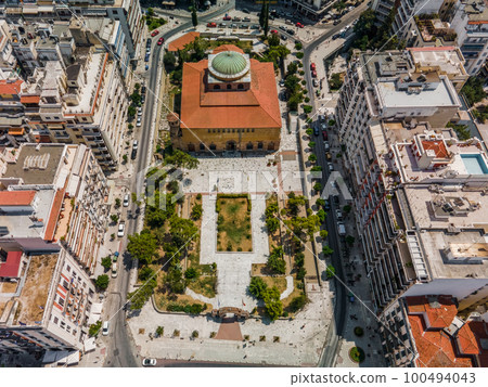 Thessaloniki, Greece aerial drone view of Hagia Sophia Byzantine church, a Christian Orthodox UNESCO World Heritage Site surrounded by buildings. Thessaloniki, Greece aerial drone view of Hagia Sophia Byzantine church, a Christian Orthodox UNESCO World Heritage Site surrounded by buildings. 100494043