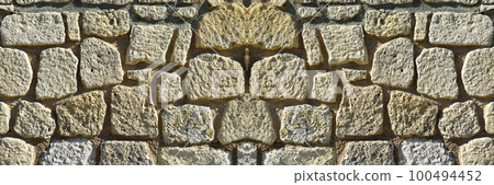 Sturdy yellow and beige cut stone wall, seamless lined up Sturdy yellow and beige cut stone wall, seamless lined up 100494452