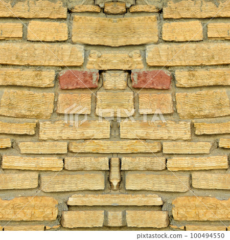 Sturdy yellow and beige cut stone wall, seamless lined up Sturdy yellow and beige cut stone wall, seamless lined up 100494550