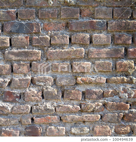 Old red brick wall vintage texture, brick wall close up texture Old red brick wall vintage texture, brick wall close up texture 100494639