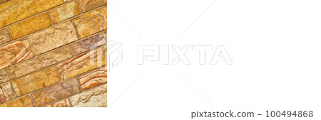 Sturdy yellow and beige cut stone wall, seamless lined up, banner mock up poster desing 100494868