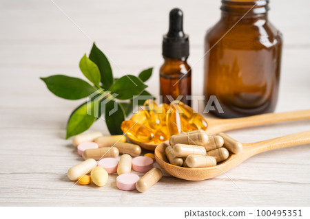 Alternative medicine herbal organic capsule with vitamin E omega 3 fish oil, mineral, drug with herbs leaf natural supplements for healthy good life. 100495351