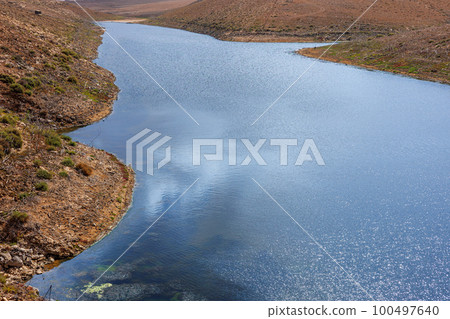 Emblase de los Molinos water reservoir in the centre of the island of Fuerteventura 100497640