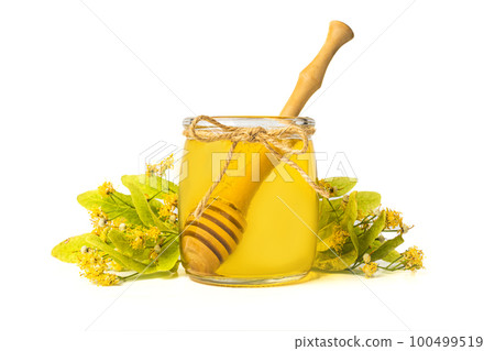 Isolated Honey bee in glass jar and with honey dipper on white background 100499519