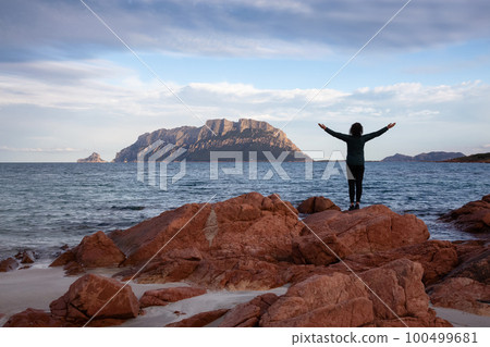 Rocky and Sandy Beach in Porto Istana, Sardinia, Italy. Tavolara Island in Background. 100499681