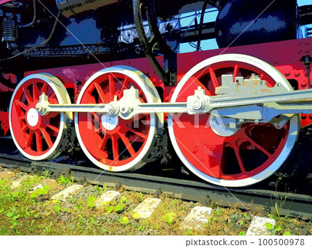Retro vintage wheels of a locomotive or train close up. Red large heavy metal wheels with piston guiding mechanisms. Locomotive of the 19th - 20th centuries with a steam engine. Bright vivid photo Retro vintage wheels of a locomotive or train close up. Red large heavy metal wheels with piston guiding mechanisms. Locomotive of the 19th - 20th centuries with a steam engine. Bright vivid photo 100500978