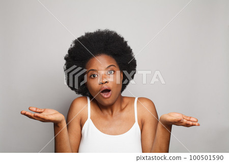 Confused young cute brunette woman shrugging shoulders, uncertain customer client thinking Confused young cute brunette woman shrugging shoulders, uncertain customer client thinking 100501590