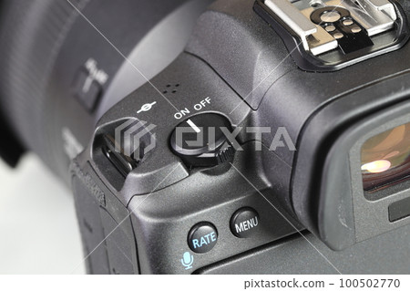 Close up top panel of professional Mirrorless Digital Camera, DSLR, show on camera on-off button mode "on". Close up top panel of professional Mirrorless Digital Camera, DSLR, show on camera on-off button mode "on". 100502770