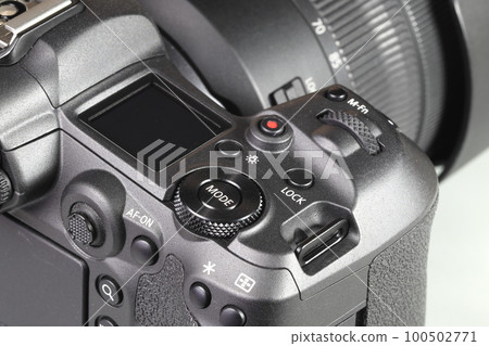 Close up top panel of professional Mirrorless Digital Camera, DSLR, show on camera mode command functional dial, function lock, light, Video record, multi function button, af-on and joystick. Close up top panel of professional Mirrorless Digital Camera, DSLR, show on camera mode command functional dial, function lock, light, Video record, multi function button, af-on and joystick. 100502771