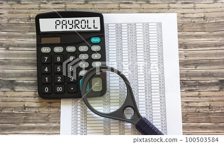 PAYROLL word on calculator. Business and financial concept PAYROLL word on calculator. Business and financial concept 100503584