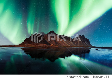 Aurora borealis Northern lights over famous Stokksnes mountains 100504211