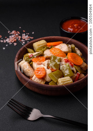 Delicious chicken slices and steamed vegetables carrots, broccoli, asparagus beans 100504964
