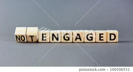 Engaged or not symbol. Concept words Engaged and Not engaged on wooden cubes. Beautiful grey table grey background. Business engaged or not engaged concept. Copy space. Engaged or not symbol. Concept words Engaged and Not engaged on wooden cubes. Beautiful grey table grey background. Business engaged or not engaged concept. Copy space. 100506551