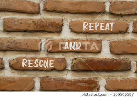 Rescue and repeat symbol. Concept words Rescue and repeat on red brown brick wall on beautiful red brown brick wall background. Business rescue and repeat concept. Copy space. 100506597