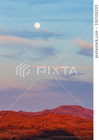 Sunset landscape with a full moon in Wichita Mountains National Wildlife Refuge Sunset landscape with a full moon in Wichita Mountains National Wildlife Refuge 100508205
