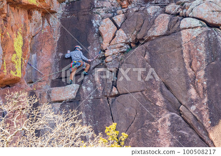 Close up shot of climber climbing in the Wichita Mountains National Wildlife Refuge 100508217