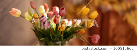 Fresh spring colorful bouquet of tulips in a vase Fresh spring colorful bouquet of tulips in a vase 100513663