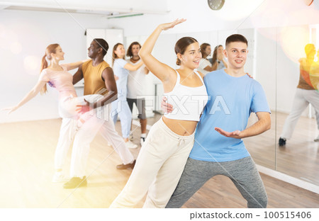 Young woman and teen boy dancing pair dance 100515406