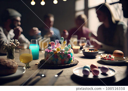 some people sitting at a table with easter eggs and other food on the table in the photo is blurry 100516338