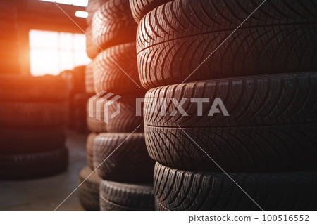 stack of car wheel tires at modern warehouse stack of car wheel tires at modern warehouse 100516552