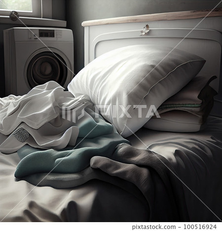 an unmade bed with two pillows and a washing machine in the background, all on top of each other items an unmade bed with two pillows and a washing machine in the background, all on top of each other items 100516924