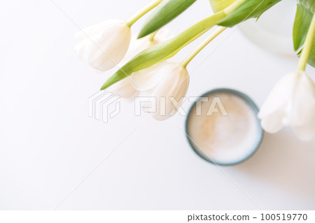 Bouquet of white tulips with cup of coffee on white background Bouquet of white tulips with cup of coffee on white background 100519770