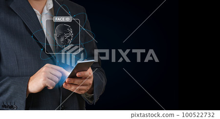 Man using mobile phone with face id scan and modern technology. Login using Face id and AI Man using mobile phone with face id scan and modern technology. Login using Face id and AI 100522732
