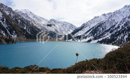 A mountain lake with blue water in winter A mountain lake with blue water in winter 100523894