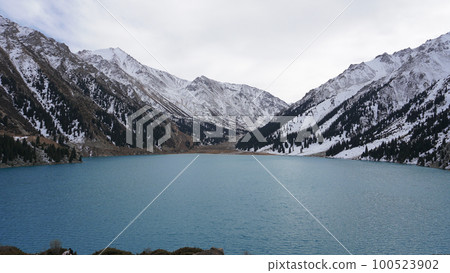 A mountain lake with blue water in winter A mountain lake with blue water in winter 100523902