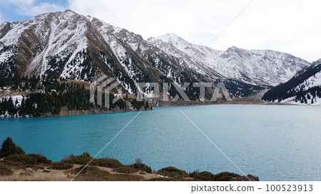 A mountain lake with blue water in winter A mountain lake with blue water in winter 100523913