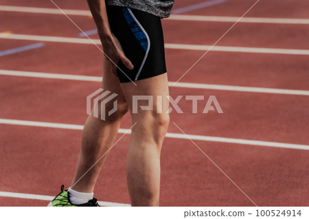 Runner track and field thigh injury Runner track and field thigh injury 100524914