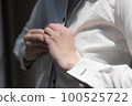 A woman buttoning her shirt upper body changing clothes image 100525722