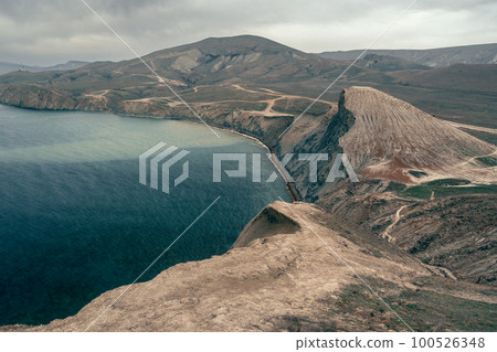 View of Dead Bay and picturesque hills from Cape Chameleon in surroundings of Koktebel. Crimea 100526348