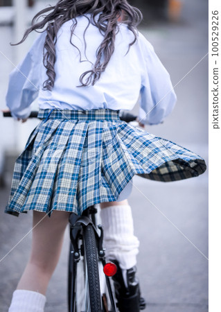 high school girl riding a bicycle 100529226