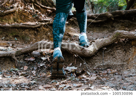 Runner's feet during trail running Runner's feet during trail running 100530896