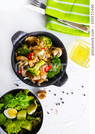 porridge with mushroom and boiled broccoli in bowl porridge with mushroom and boiled broccoli in bowl 100531490